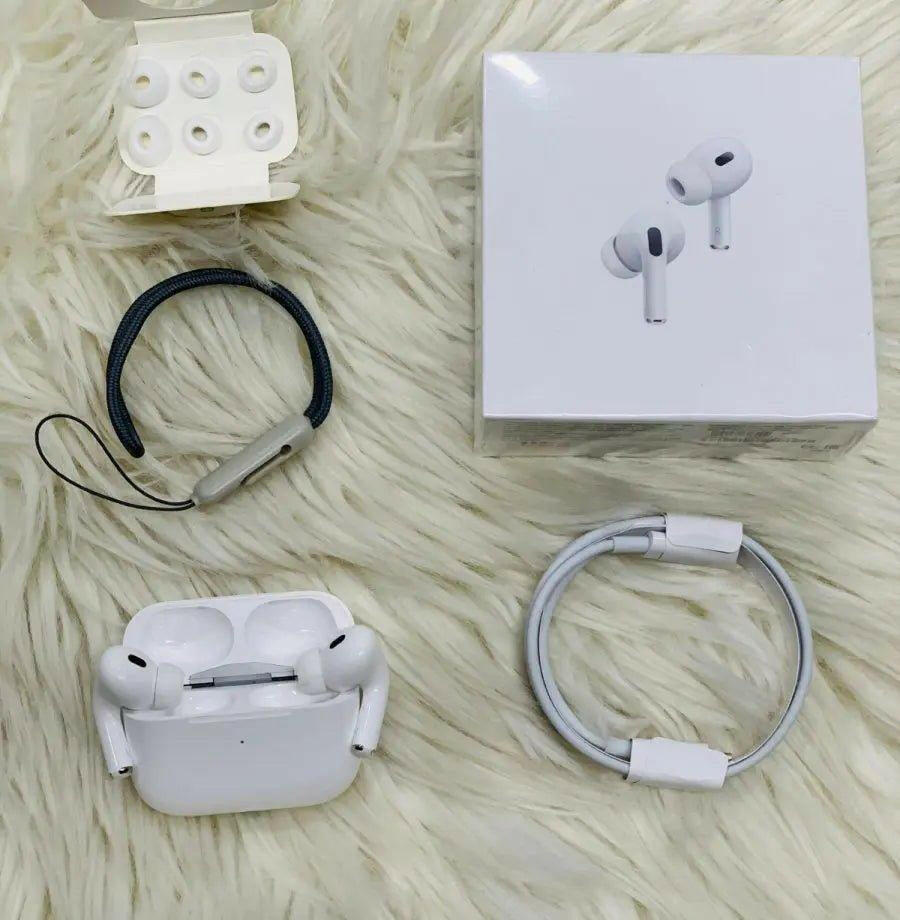 Noise-cancelling AirPods Pro 2nd Generation with charging case and accessories on fluffy background